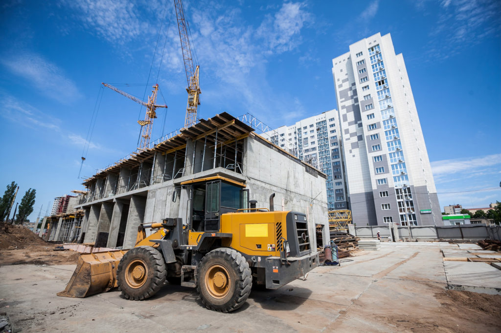 Yellow bulldozer working at the construction site